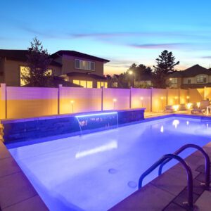 A pool with lights on the side of it